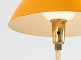 a yellow table lamp on a white background