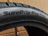 a close up of a tire with a box in the background