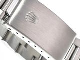 an image of a close up of a watch on a white surface