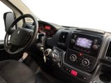 the interior of a car with a steering wheel and dashboard controls