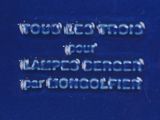 a close up of a blue plaque with words on it