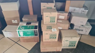 many boxes stacked on top of each other on the floor