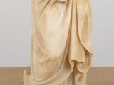 a statue of a woman holding a baby in her arms