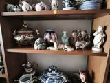 a wooden shelf with many different types of vases on it