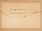 an old paper with writing on it sitting on top of a table