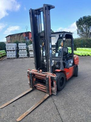 a forklift that is parked in a parking lot