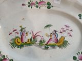 a plate with a picture of two people on it