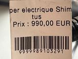 a price tag on the handlebar of a motorcycle