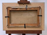 an old picture frame with writing on it sitting on top of a wooden easel