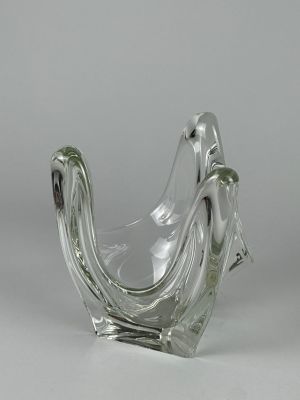 a glass vase that is shaped like a bird