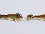 two pairs of gold and turquoise earrings on a white surface