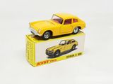 a yellow toy car sitting on top of a box