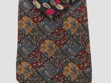 several different colored ties are stacked on top of each other