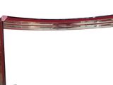 an image of a red and silver shelf with a mirror on it