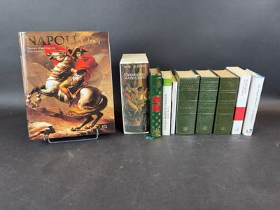 the books are lined up on a table next to each other
