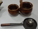two cups and a teapot on a table