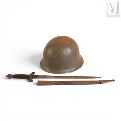 an old helmet and a knife sitting on a white surface