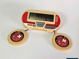 two game controllers sitting next to each other on a table
