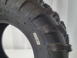 a close up of a tire on a white surface