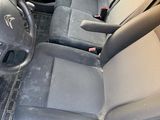 a picture of the interior of a car with a steering wheel