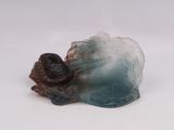 a blue and white object on a white surface