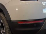 a close up of the rear end of a white car