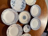 a wooden table with a bunch of plates on top of it