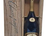 a wooden box with a bottle of wine inside of it