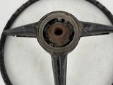 an old steering wheel with a hole in the center of it