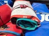 a pile of luggage sitting in the trunk of a car