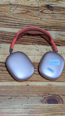 an image of a pair of headphones sitting on top of a wooden floor