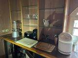 a kitchen counter with a microwave and a blender on it