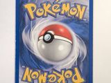 a close up of a pokemon card with a ball on it