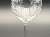 a wine glass that is sitting on a table