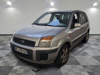 a silver car that is parked on a checkered floor