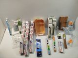 many toothbrushes, toothpaste, toothpaste, toothpaste, toothpaste, toothpaste, toothpaste, and