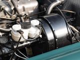 a close up of a car ' s engine with its hood open