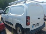 a white van that is parked in a parking lot