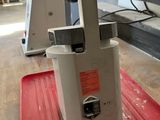 a machine that is sitting on top of a red mat