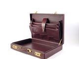 leather briefcase with four compartments and two compartments open on a white surface