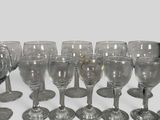 a lot of wine glasses that are sitting on a table