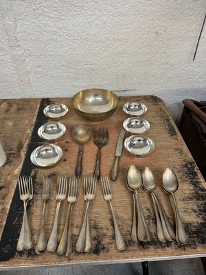 a table with silverware and silverware on it