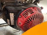 a close up of a red and black engine on a yellow table