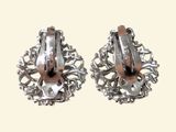 pair of silver and rose gold tone earrings on a white background
