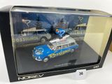 a toy car in a display case on a table