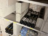 many bottles and cans of alcohol on the shelves in the room