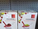 two boxes of food sitting on a shelf in a store