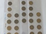 a lot of coins in a plastic bag on a table