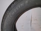 tire tread of a car on a white surface in a room