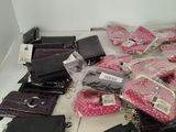 a lot of purses and wallets on the floor